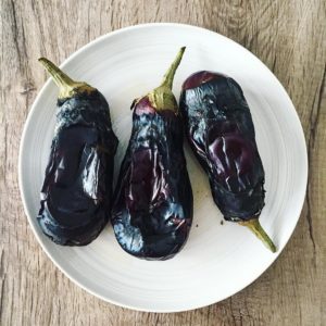 Burnt fire-cooked aubergines