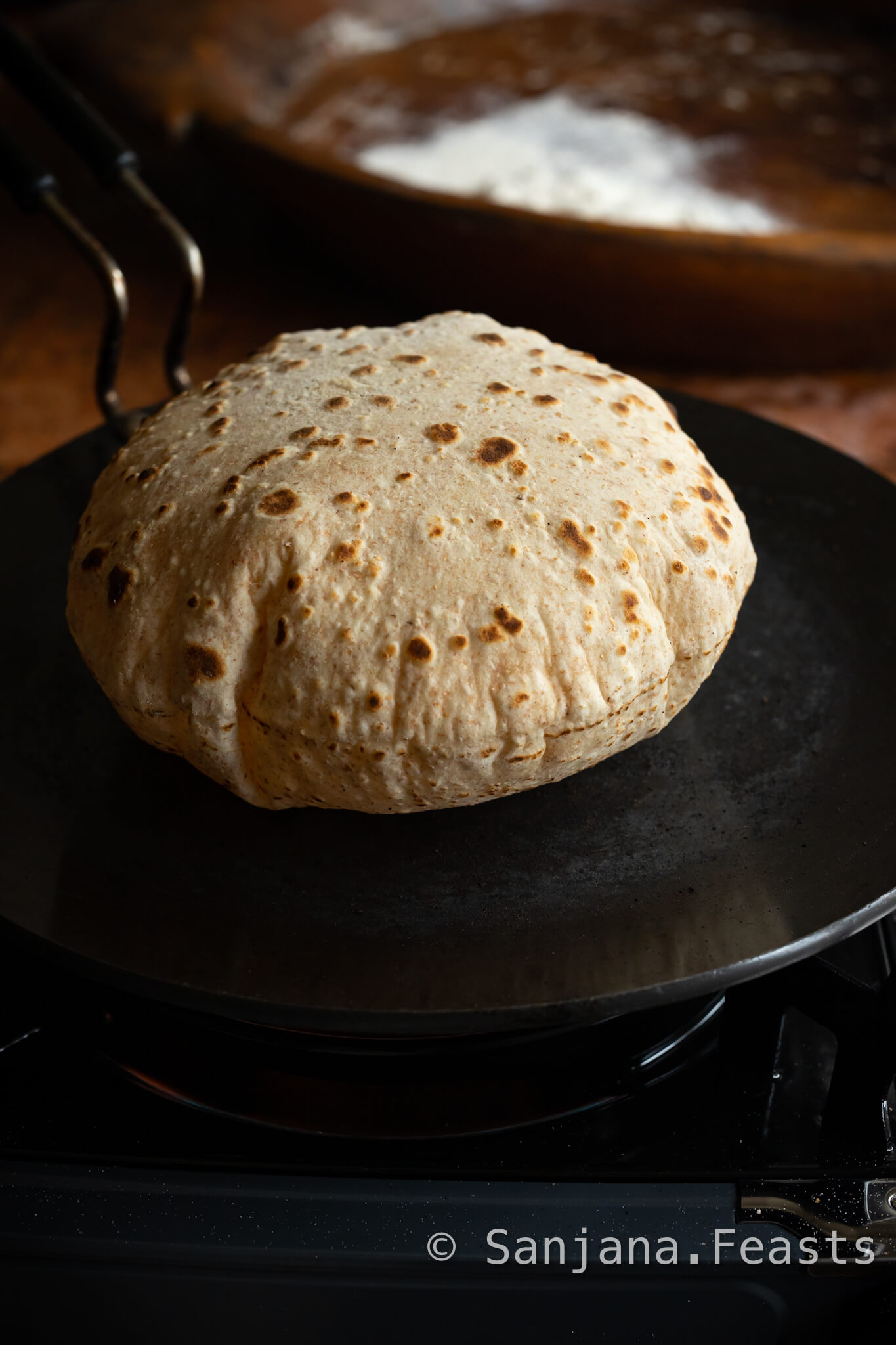 Roti Recipe - Homemade Chapati puffing up on a tawa