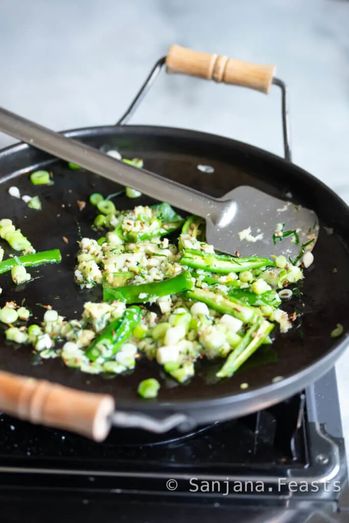 cook the spring onions and aromatics