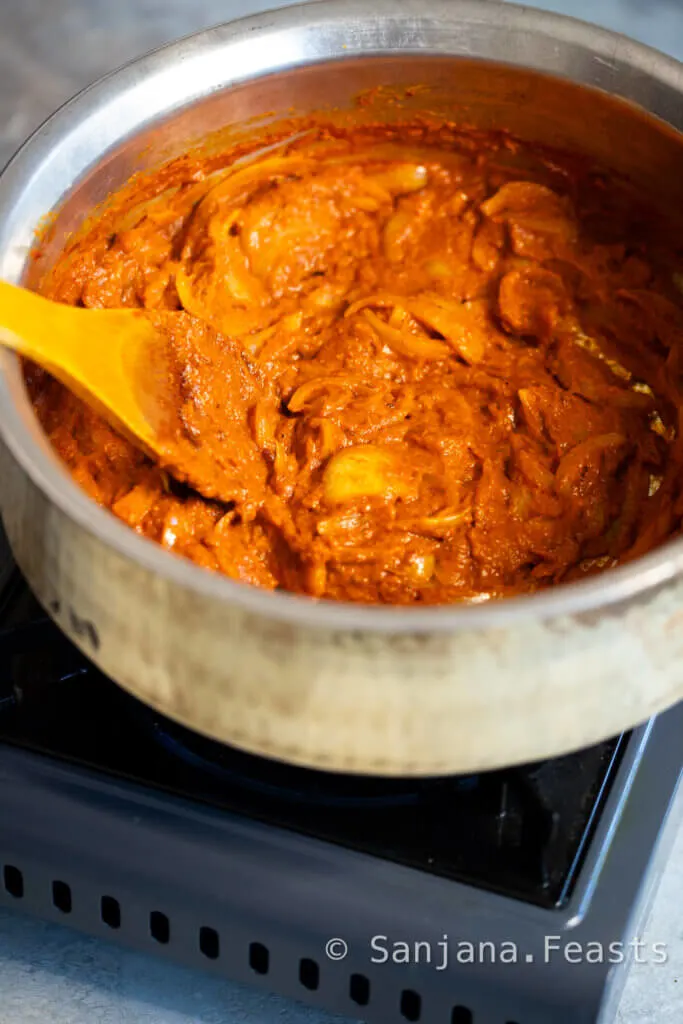 Ensure the oil separates from the red curry paste