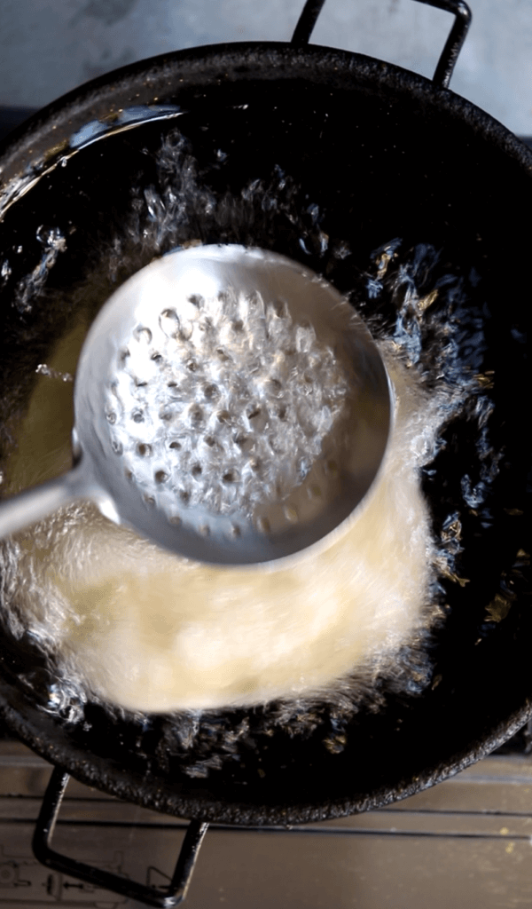 Frying puri for halwa puri