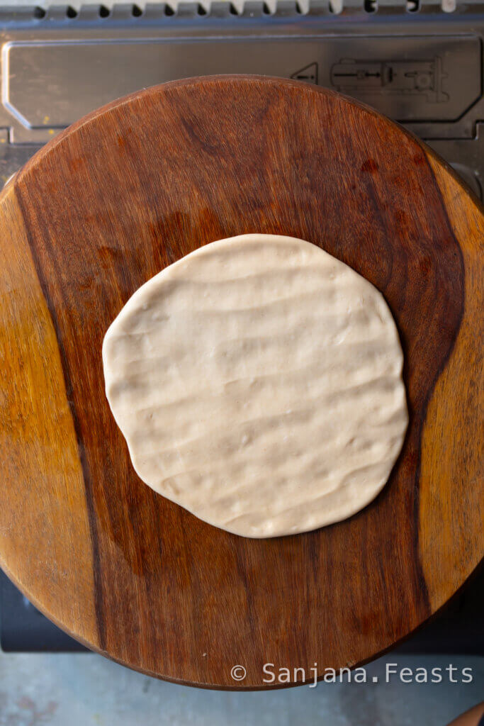 flatten the puri dough into a circle